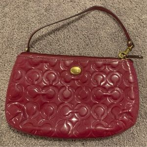 Shimmery pinkish/purple Coach handbag in new condition